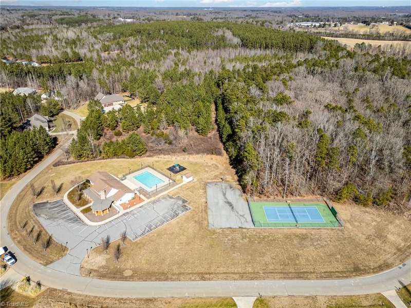 Sunset Pointe clubhouse, swimming pool, tennis court.