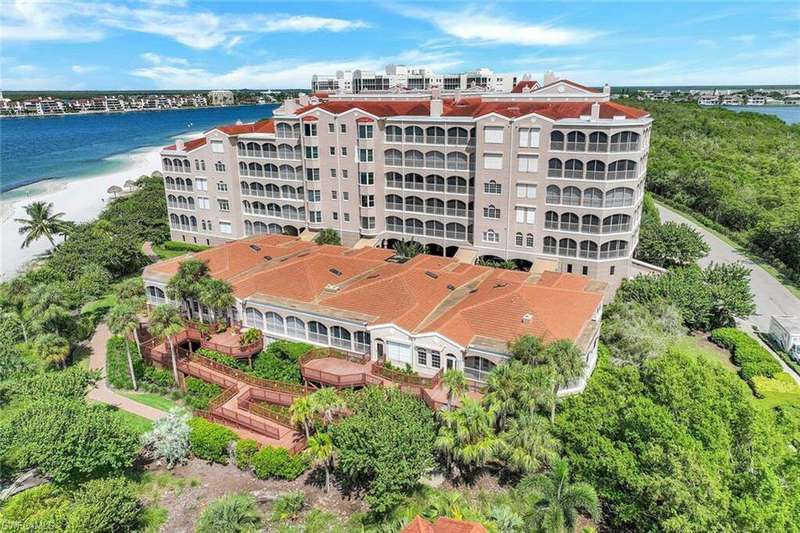 Bird's eye view with a view of the beach and a water view