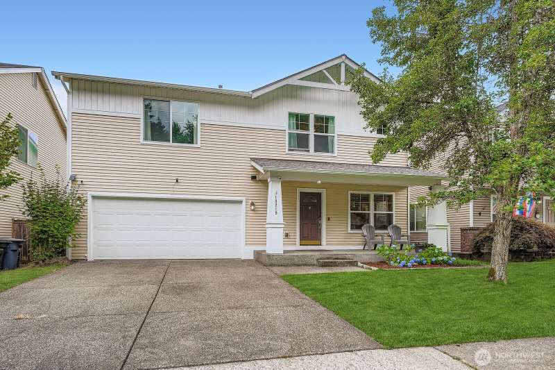 Front of home w/ two car garage and ample driveway parking