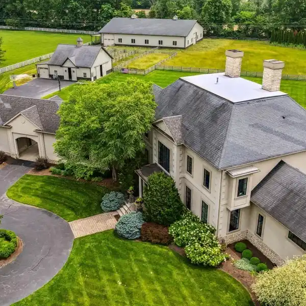 Custom Home on 6.1 Acres with Stocked Pond and Arena