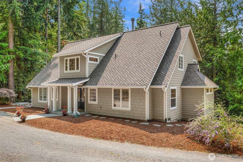 13310 Madrona Road SW rests on 5 acres of beautiful woodland on the popular westside of Vashon Island.