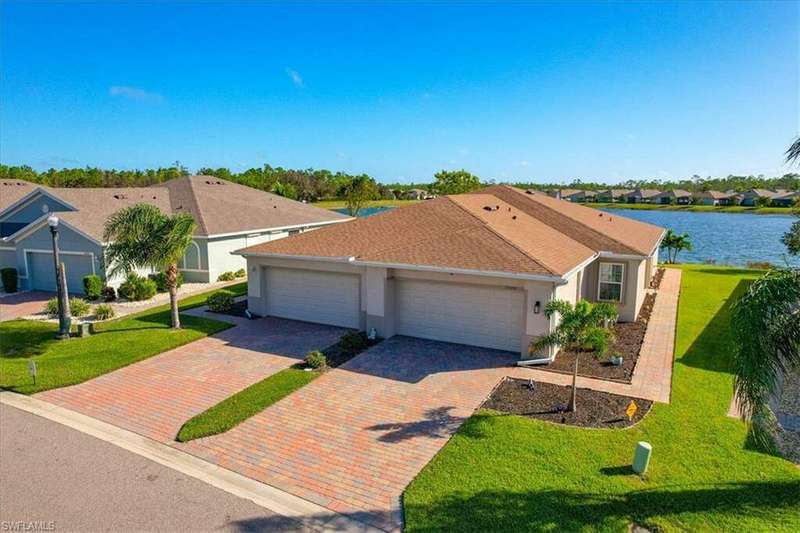 Single story villa with a 2 car garage and water view