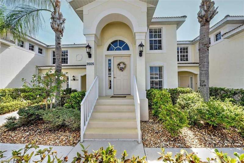Entrance to property featuring stucco siding