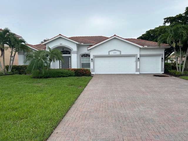 Single level home, spacious paved driveway and 3 car garage