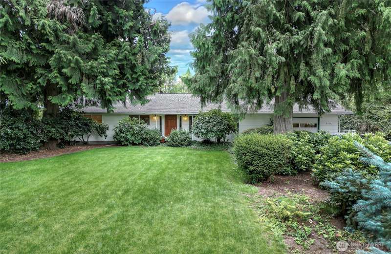 Lovely Auburn rambler on quiet 3/4-acre park-like property.