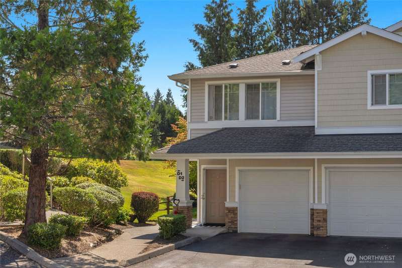 Light and bright top floor condo with soaring vaulted ceilings