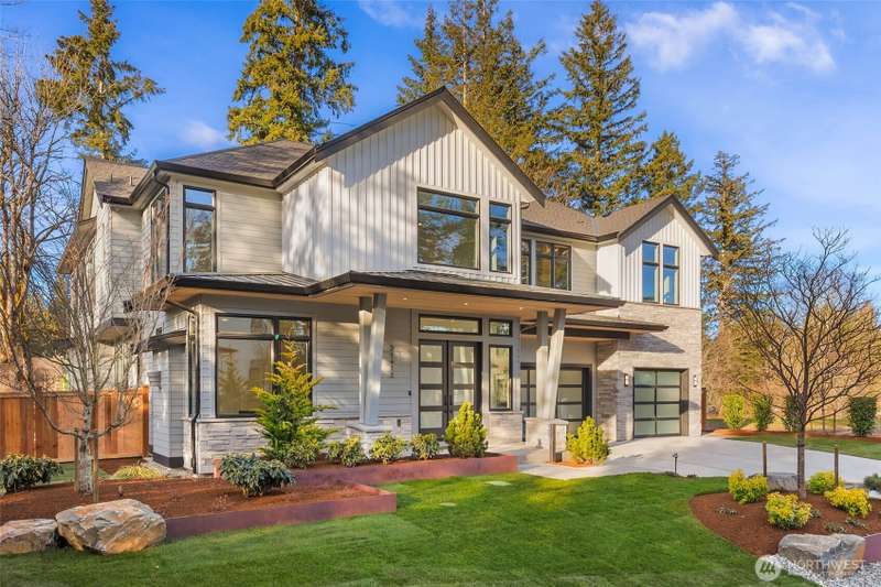 Stunning Curb appeal. Custom lansdcape design utilizes large natural stones, mature trees, custom built corten steel planting beds, and high end lanscape lighting. 3rd of this limited offering of 4 custom residences by one of the regions most respected na