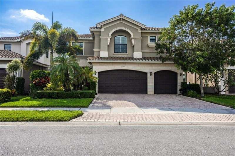 Mediterranean / spanish-style home featuring a garage