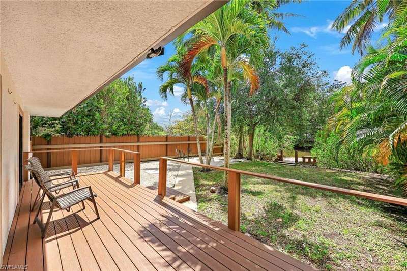 Back yard with large sun deck and access to the private dock and canal