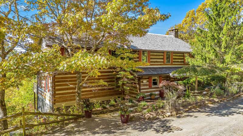 Introducing an exceptional antique log home tucked away within the captivating Stonebridge community.
