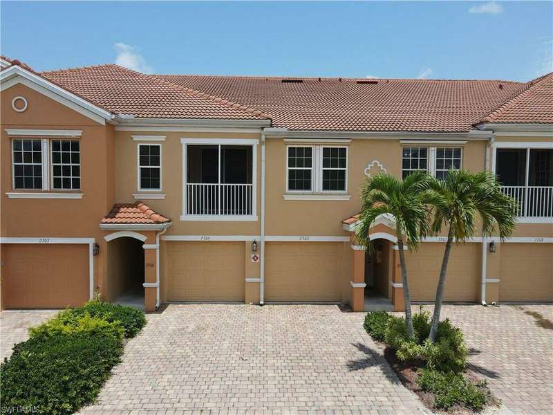 Townhome / multi-family property featuring a garage