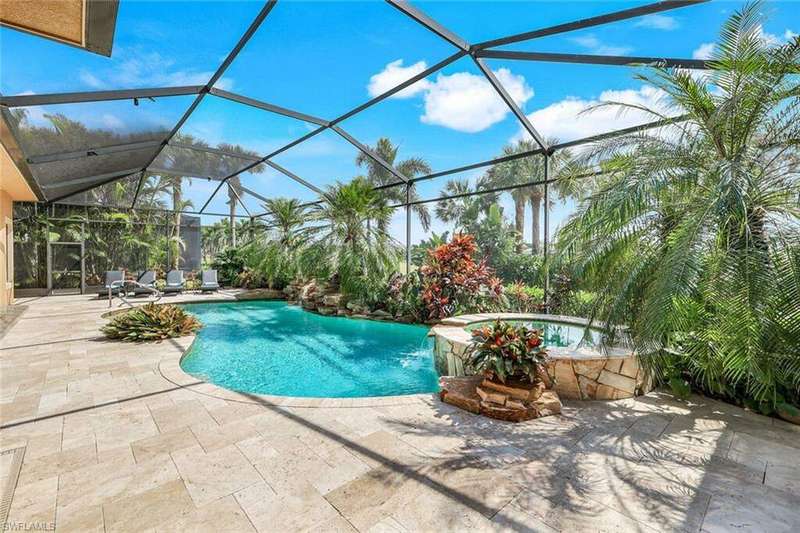 Welcome to this resort style pool and spa with flagstone detail overlooking the golf course. Wait until you see the outdoor fireplace and summer kitchen!