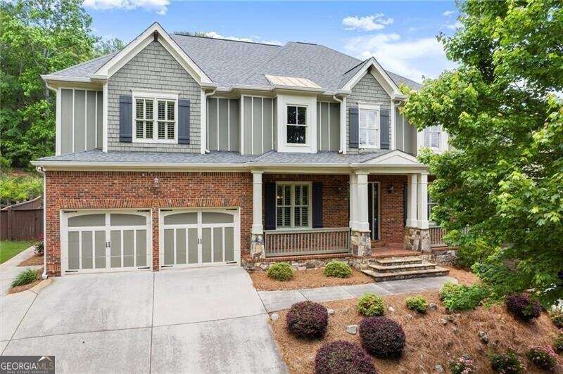 Showcasing this charming home in the heart of Waterside at Lanier Springs. Visit 1286whispercove.com/mls for more information.