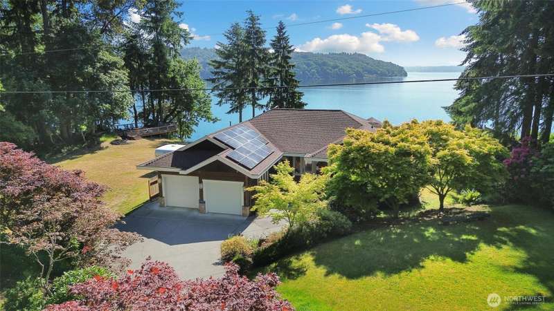 This extraordinary property offers unparalleled privacy, a private-access beach, boat mooring, a versatile ADU.