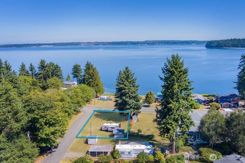 This beautiful corner lot is yours. The outline shown here is a visual photo estimation but corners are marked onsite.