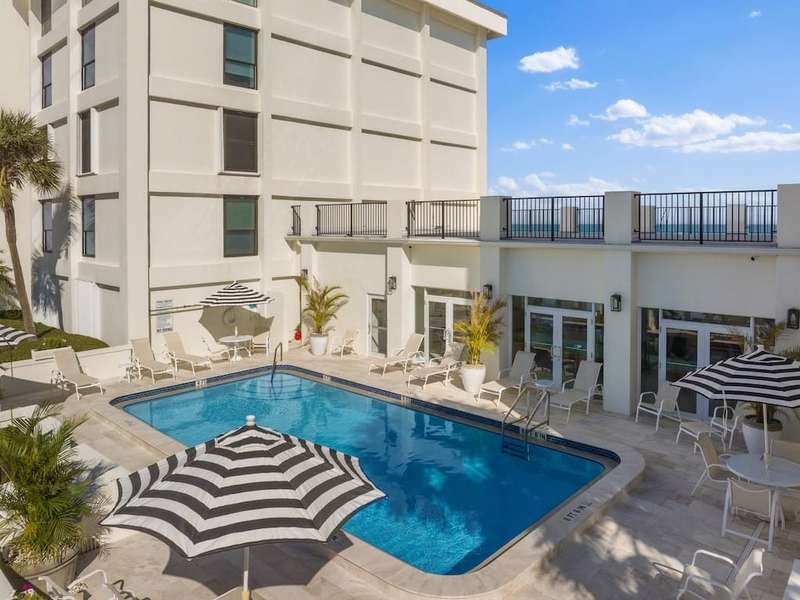Community pool featuring a patio