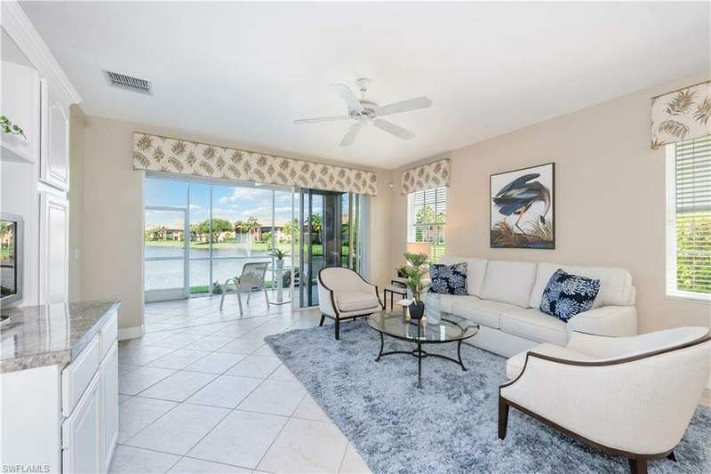 Tiled living room featuring ceiling fan