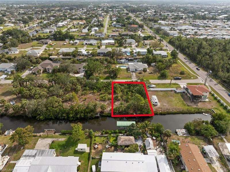 Bird's eye view featuring a water view and a residential view