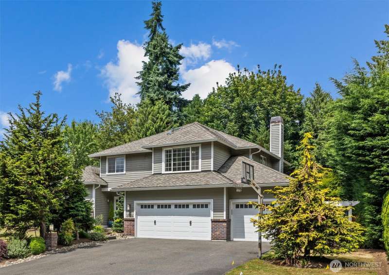 Welcome home!  Three-car garage has two very deep bays creating extra shop space or potentially parking for more than three vehicles.