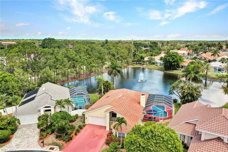 Only 3.7 Miles to 5th Avenue.  Aerial view of home and gorgeous fountain and lake view