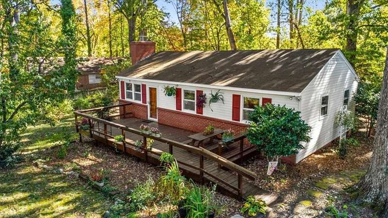Hidden off Tower Rd the long driveway leads to this adorable ranch