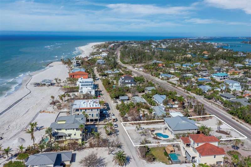 An incredible home located on an oversized 19,800 sf of precious Longboat Key property just steps from the sparkling Gulf of Mexico.
