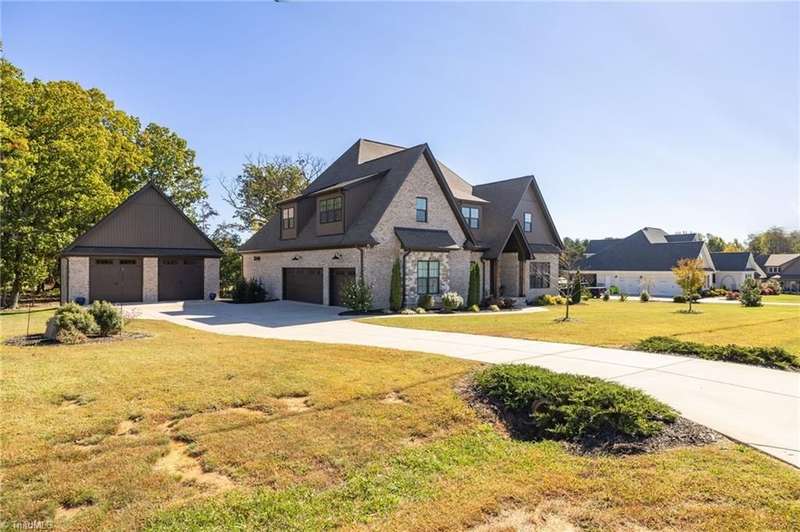 Side Exterior ? Spacious driveway and beautifully designed rooflines showcase curb appeal and modern craftsmanship.