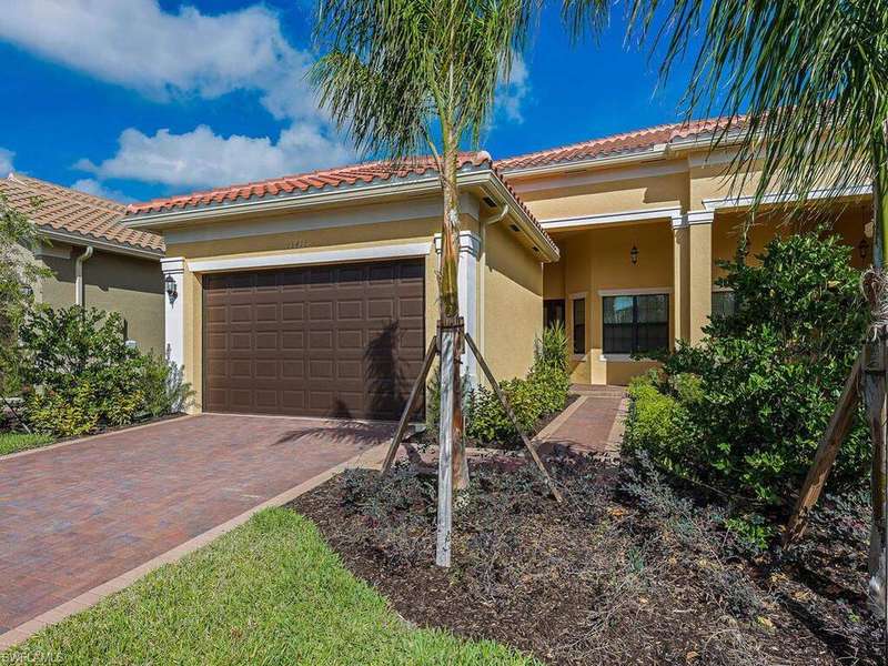 Mediterranean / spanish house with stucco siding, decorative driveway, an attached garage, and a tiled roof