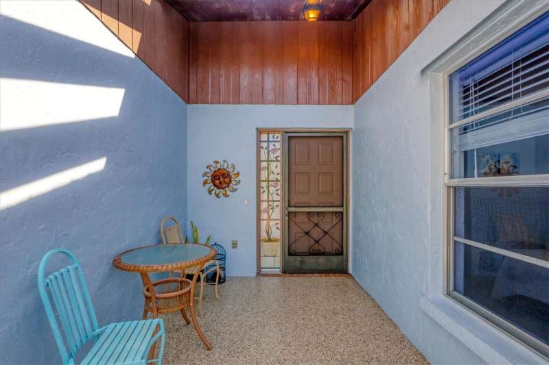 610 Apple Lane screened in front entry. 610 Apple Ln., Englewood, FL 34223