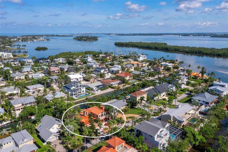 An amazing location on a nice wide canal in the fabulous single family home community of Sleepy Lagoon on Longboat Key.