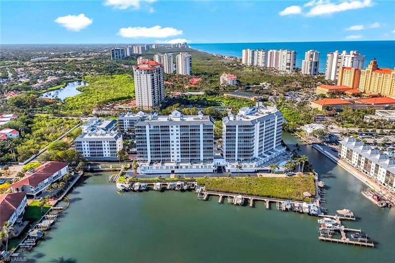 View of urban area with a nearby body of water and apartment complex