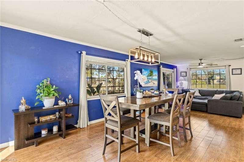 Back of property featuring a yard, a patio, and central AC unit