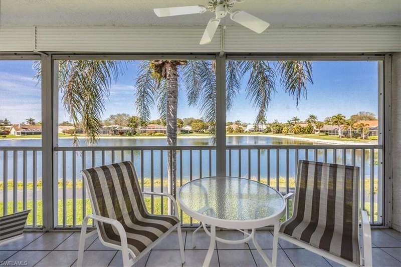 Unfurnished sunroom featuring a water view