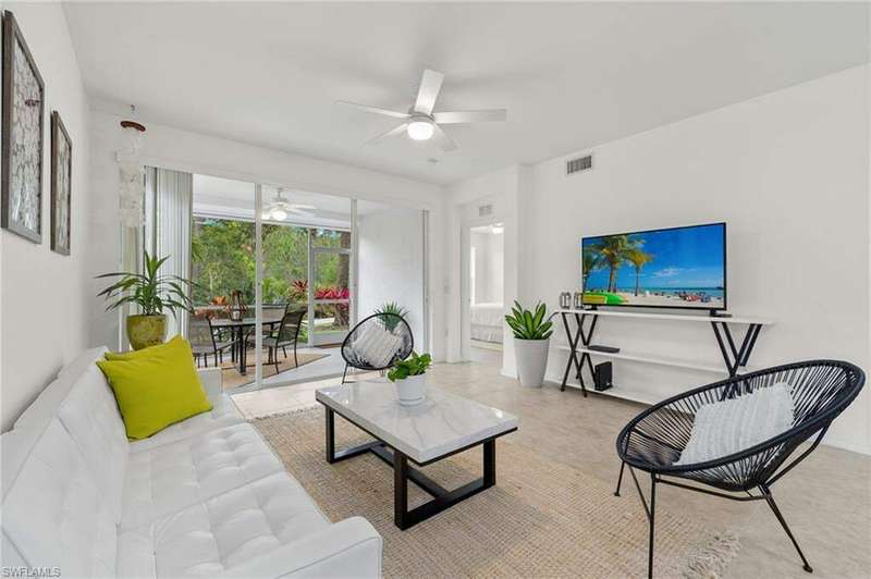 Living room featuring ceiling fan