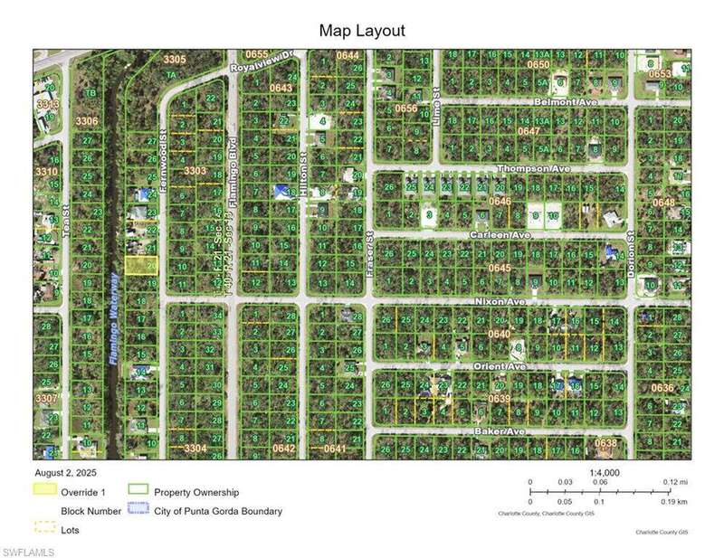 View of asphalt street featuring a forest view