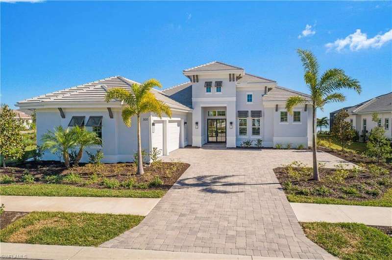 View of front of house with french doors and a garage