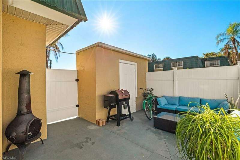 Back of property featuring a yard, a patio, and central AC unit