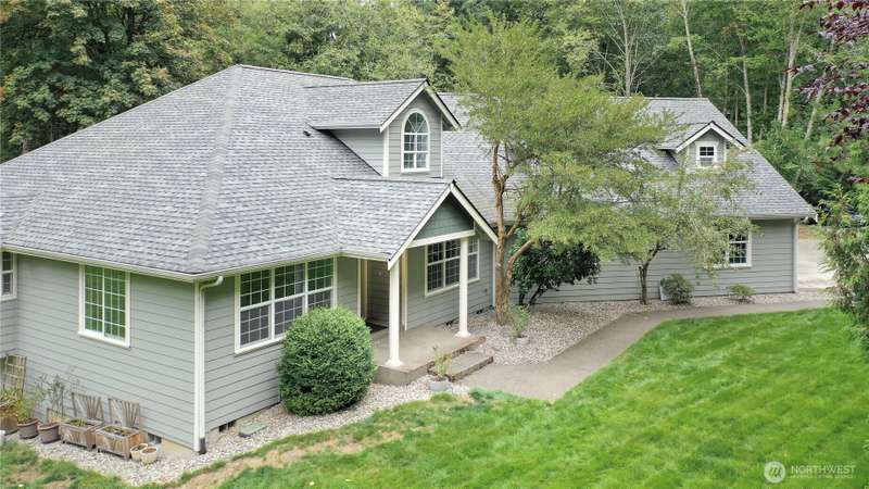 Drone view of front of home, curb appeal for sure!