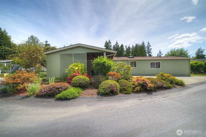 This lovely home enjoys one of the best lots in Poulsbo's Viking Park, beautifully positioned on this corner lot and enhanced by mature landscaping that offers vibrant blooms throughout the seasons.