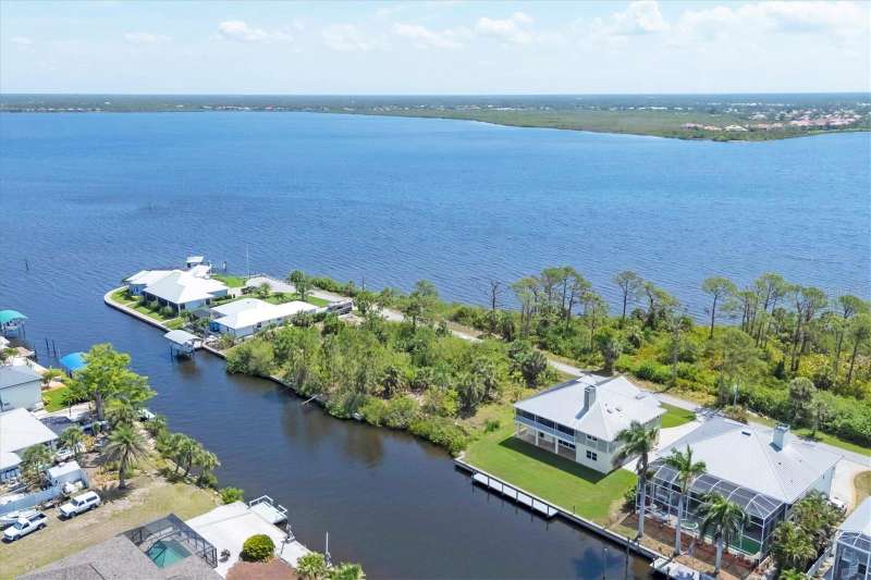 Water views abound overlooking the Myakka River from the front and a saltwater canal in the rear
