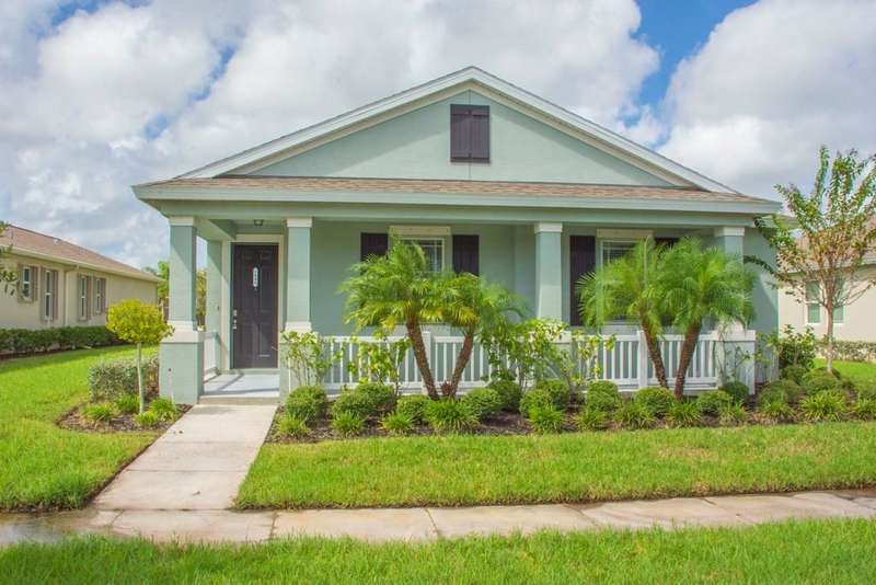 View of front of house featuring stucco siding, a