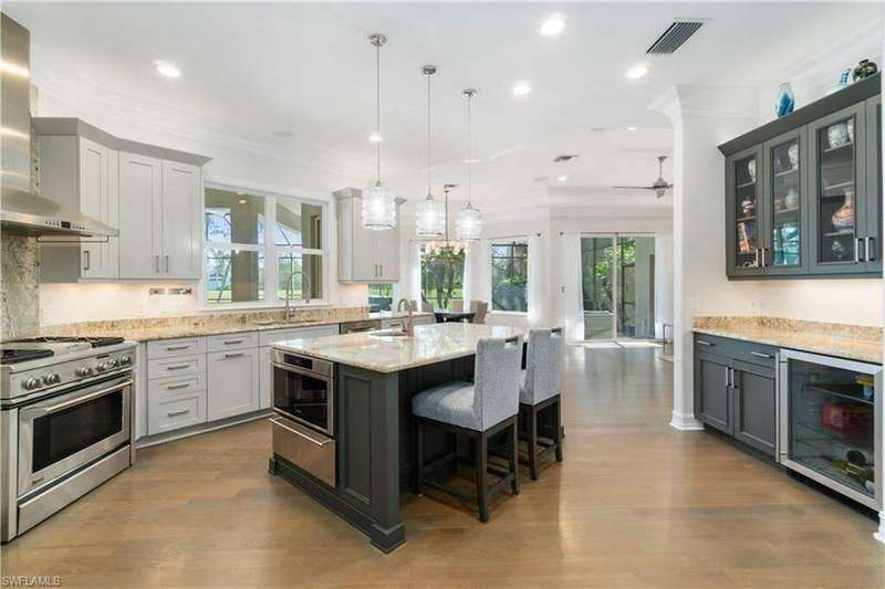 Open and airy kitchen looking out to the lanai and family room