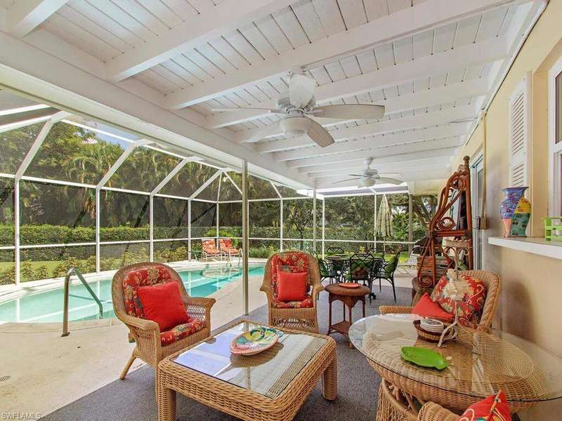 The screened, heated pool is perfect for lounging, casual dining and all-weather seating.