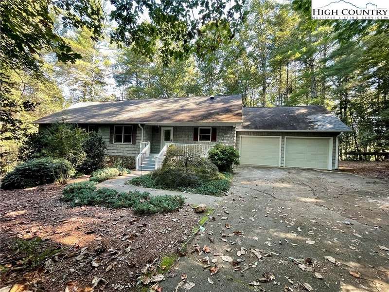 Private wooded setting with 2 car attached garage.