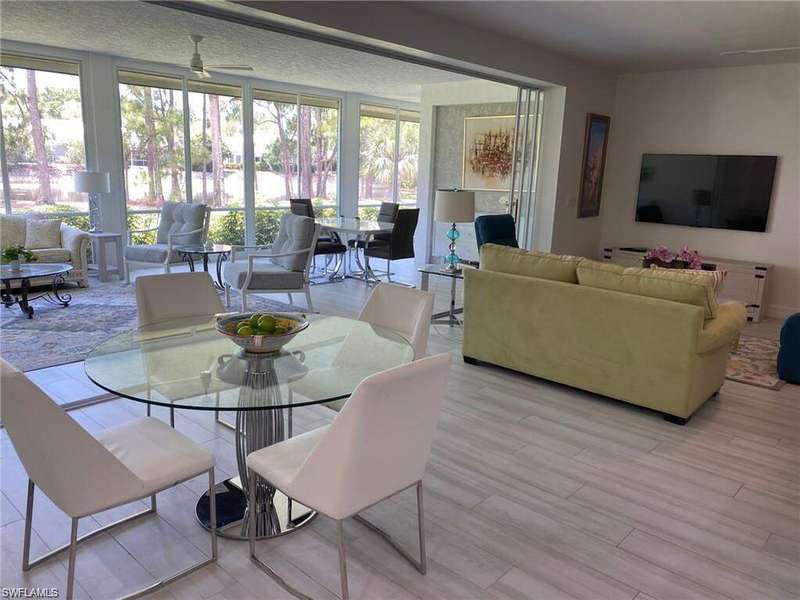 Dining area featuring a ceiling fan and wood finished floors