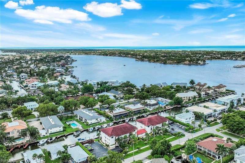 Aerial view of residential area with a large body of water