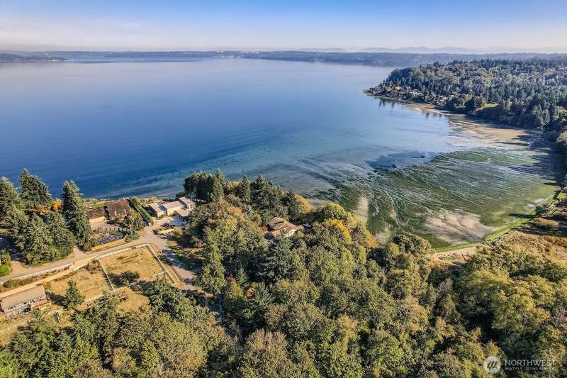 Taken from drone above property.  Approximately 229 feet of Puget Sound Water frontage which is to the right in this picture.