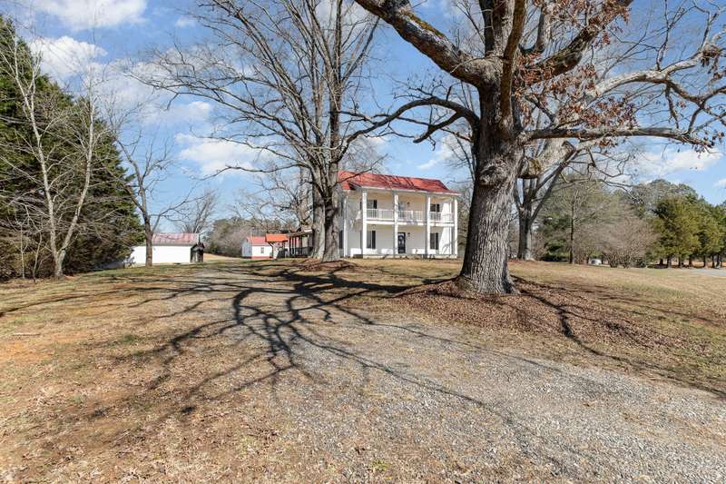 Gorgeous restored farmhouse on 15.6 acres mostly cleared.