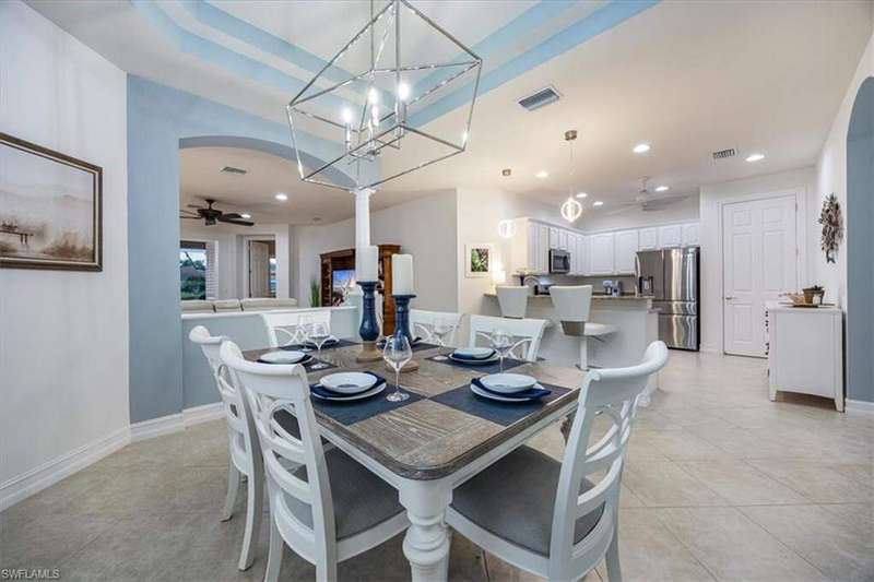 Double tray ceiling with updated light fixture for a beautiful formal dining area, plenty of space for a many around the table!