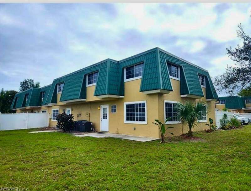 Back of property featuring a yard, a patio, and central AC unit